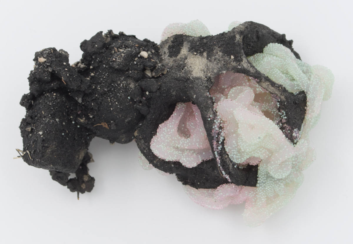 Devious Frequency 9, 2022: silicone, stoneware, air-dry clay, glass, pva, acrylic paint, dirt, rocks, grass, 6 inches x 3 inches x 2 inches