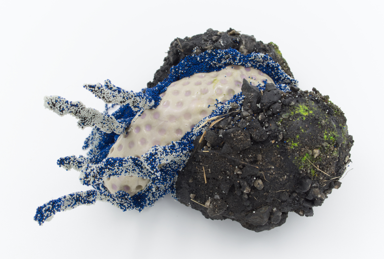 Devious Frequency 13, 2022: silicone, air-dry clay, resin, glass, pva, mica, acrylic paint, dirt, rocks, grass, 5 inches x 4 inches x 4 inches